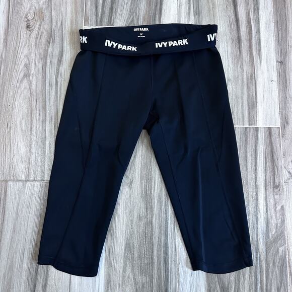IVY PARK Leggings Sz M black Logo Waist pull on athletic Gym Capri Biker Pockets - Picture 1 of 6